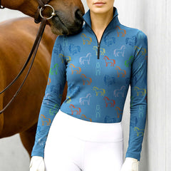 Woman wearing RIDER ATELIER multicolor line art horse teal blue equestrian quarter-zip top at the barn with a chestnut horse
