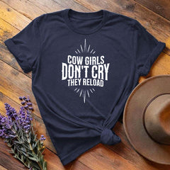 Navy blue "Cow Girls Don't Cry They Reload" western equestrian t-shirt, flat lay on wooden background