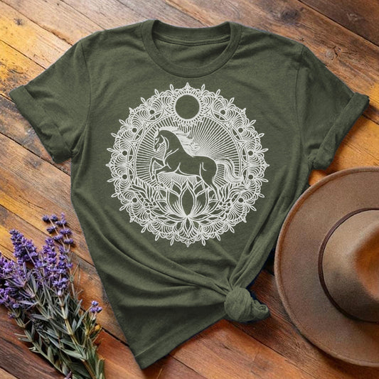 Olive green "Mandala Horse" equestrian t-shirt, flat lay on wooden background with intricate white mandala print