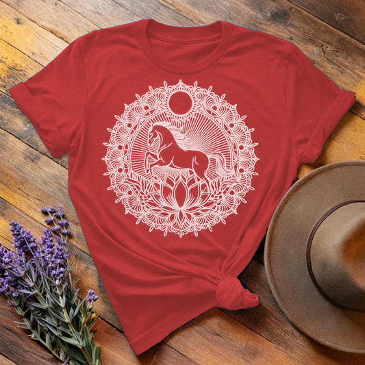 Red "Mandala Horse" equestrian t-shirt, flat lay on wooden background with intricate white mandala print