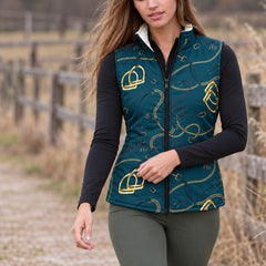 Deep teal reversible quilted equestrian vest with gold stirrup and chain print styled over a black quarter zip top