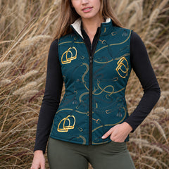 Close up of gold stirrup and chain print on deep teal reversible quilted equestrian vest