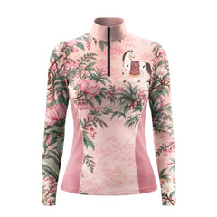 Light pink long sleeve quarter zip riding top with darker pink side panels, a printed white horse on the upper left chest, and floral artwork across the front and sleeves