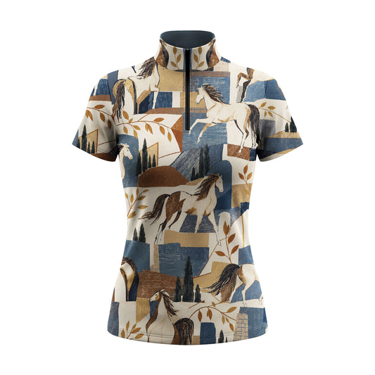 Front studio view of the blue colorway short sleeve quarter zip riding top on a white background, showing the full all over horse and floral print